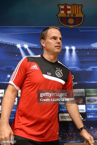 Ajax's head coach Frank de Boer arrives to a press conference at Camp Nou stadium in Barcelona on September 17 on the eve of the UEFA Champions...