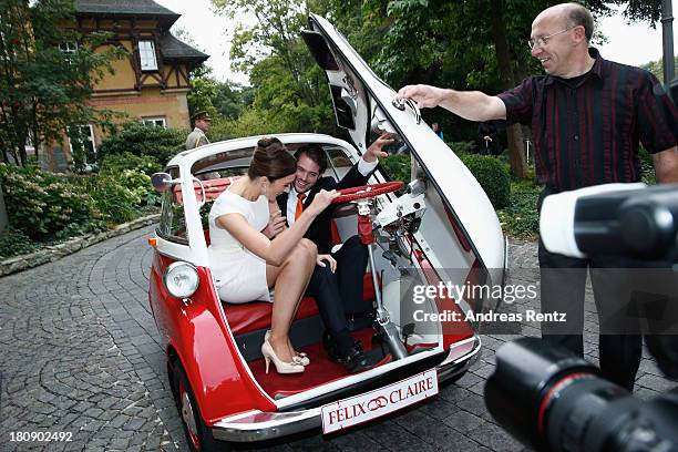 Prince Felix Of Luxembourg and Princess Claire of Luxembourg depart in the Italian-designed BMW Isetta 300 microcar after their Civil Wedding...