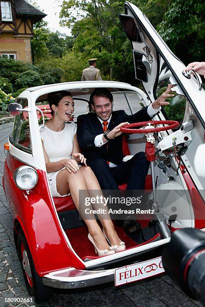 Prince Felix Of Luxembourg and Princess Claire of Luxembourg depart in the Italian-designed BMW Isetta 300 microcar after their Civil Wedding...