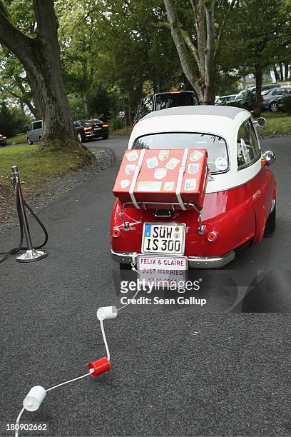 Prince Felix Of Luxembourg and Princess Claire of Luxembourg depart in the Italian-designed BMW Isetta 300 microcar after their Civil Wedding...