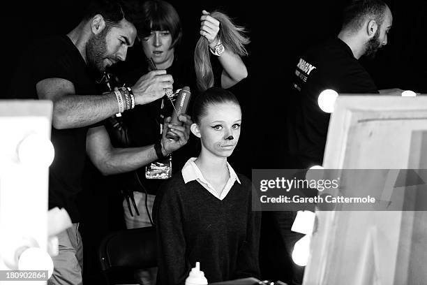 Model backstage before the Fashion East show during London Fashion Week SS14 at TopShop Show Space on September 17, 2013 in London, England.