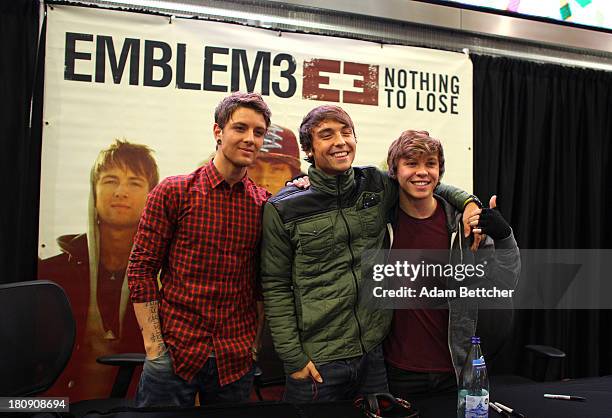 Wesley Stromberg, Keaton Stromberg and Drew Chadwick of the band Emblem3 greets fans on September 20, 2013 at Mall of America in Bloomington,...