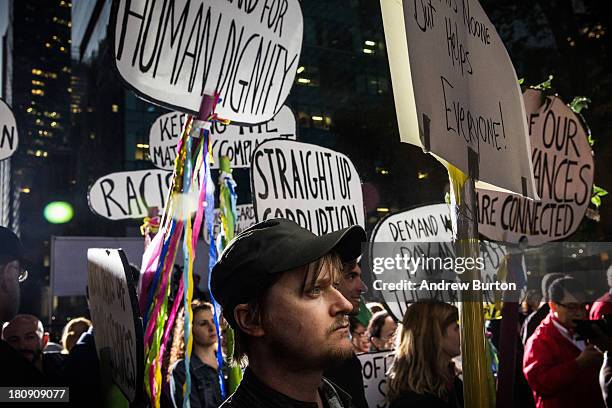 Occupy Wall Street protesters attend a rally in Bryant Park after marching from the United Nations building on September 17, 2013 in New York City....