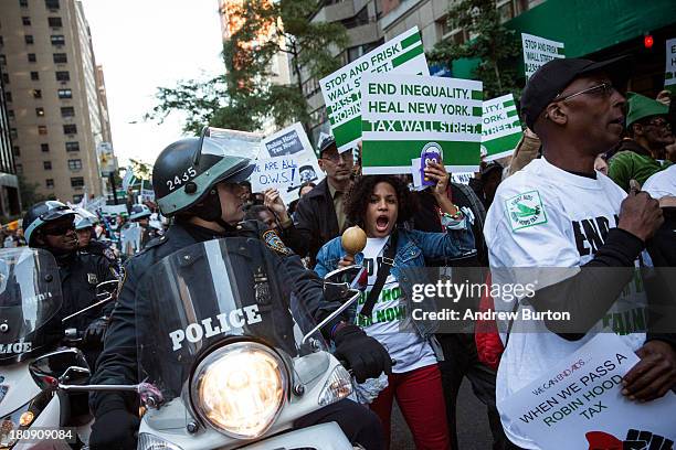 Occupy Wall Street protesters march from the United Nations building to Bryant Park on September 17, 2013 in New York City. The march centered around...