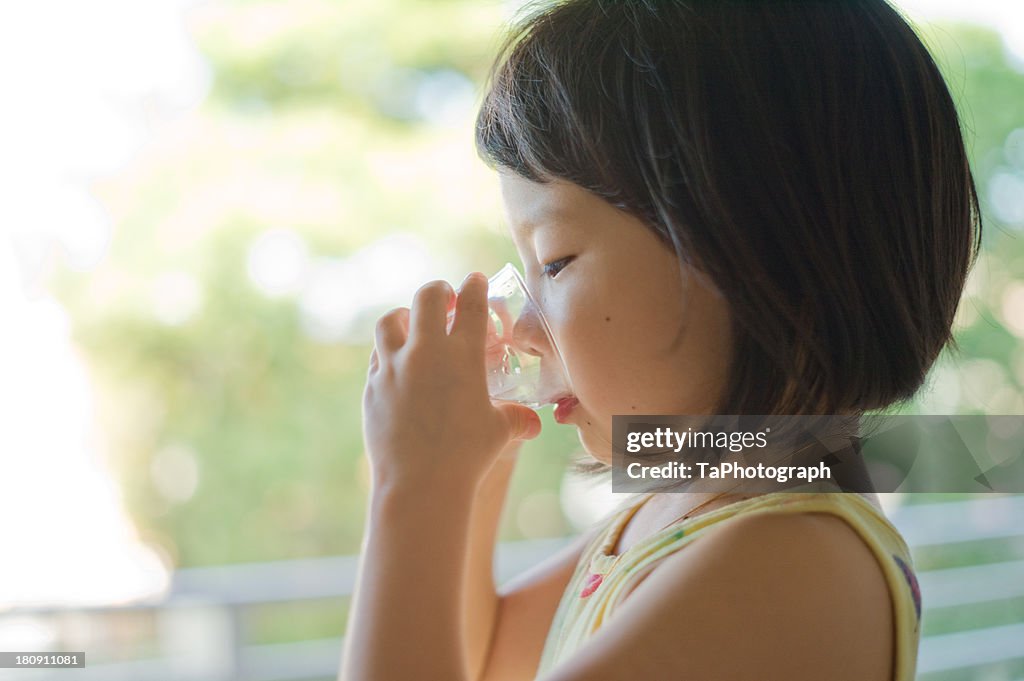 Girl drinking glass of water