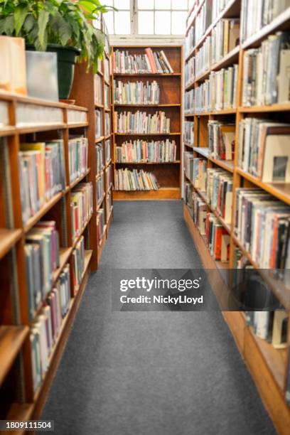 interior of a college library with bookshelves - public library stock pictures, royalty-free photos & images