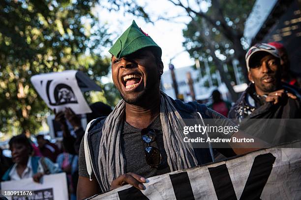 An Occupy Wall Street protester participates in a march from the United Nations building to Bryant Park on September 17, 2013 in New York City. The...