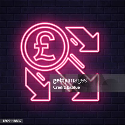 Pound decrease. Glowing neon icon on brick wall background Pound decrease. Glowing neon icon on brick wall background