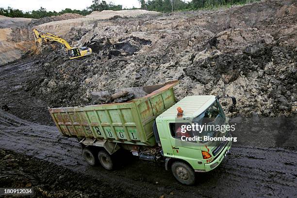 Truck carries coal at the PT Exploitasi Energi Indonesia open pit coal mine in Palaran, East Kalimantan province, Indonesia, on Friday, Sept. 13,...