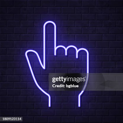 Hand cursor - pointer. Glowing neon icon on brick wall background Hand cursor - pointer. Glowing neon icon on brick wall background