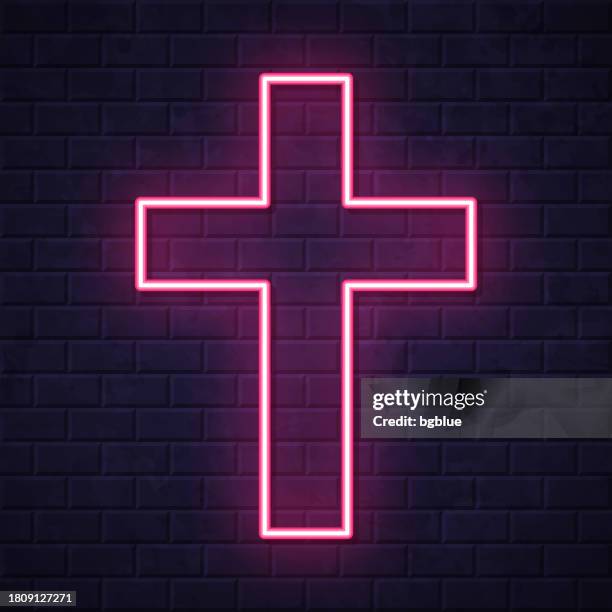 religion cross. glowing neon icon on brick wall background - celtic cross vector stock illustrations