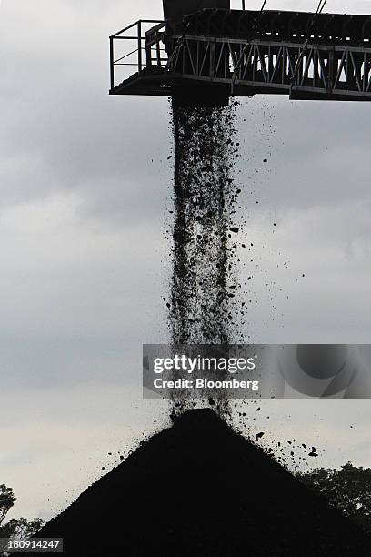 Conveyor drops coal onto a stockpile at the PT Exploitasi Energi Indonesia open pit coal mine in Palaran, East Kalimantan province, Indonesia, on...