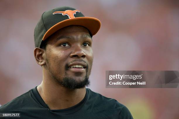 Kevin Durant of the Oklahoma City Thunder enjoys the game from the sidelines as the Texas Longhorns host the Mississippi Rebels on September 14, 2013...