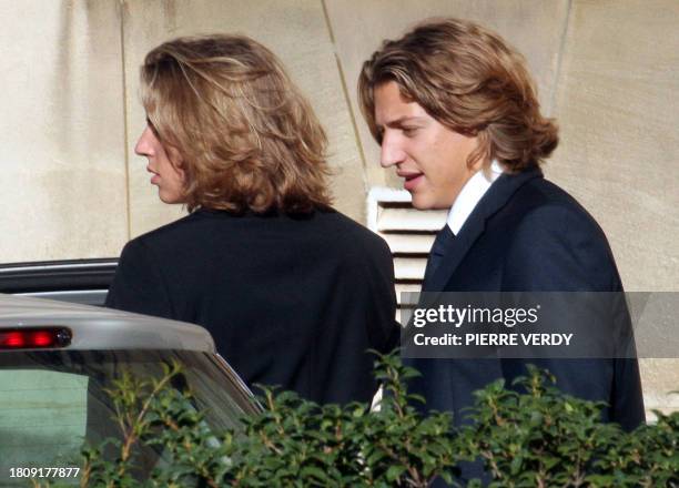 Jean Sarkozy, son of French President Nicolas Sarkozy chats with his brother Pierre as they arrive at the city hall in Neuilly-sur-Seine, outside...