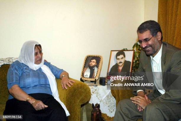 Iranian charge d'affaires in Lebanon Hamid Reza Dahkani meets 18 May 2004 with Siham, the mother of Samir Kantar, a veteran Lebanese prisoner jailed...