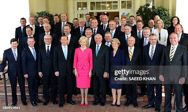 Australia's new Prime Minister Tony Abbott poses with Governor-General Quentin Bryce for a group picture with his newly inducted cabinet after a...