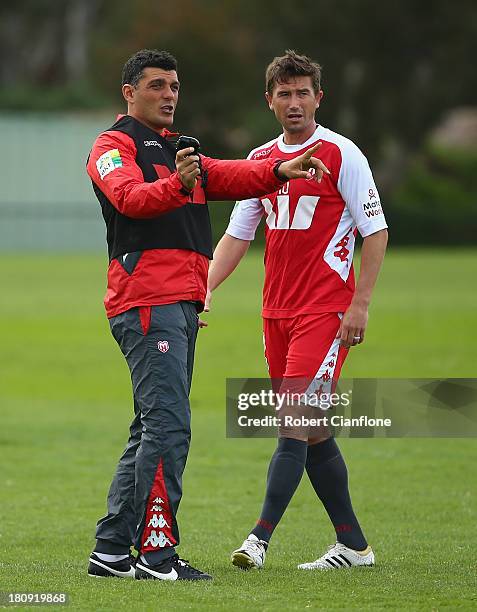 Heart coach John Aloisi talks with Harry Kewell during a Melbourne Heart A-League training session at the La Trobe University Playing Fields on...