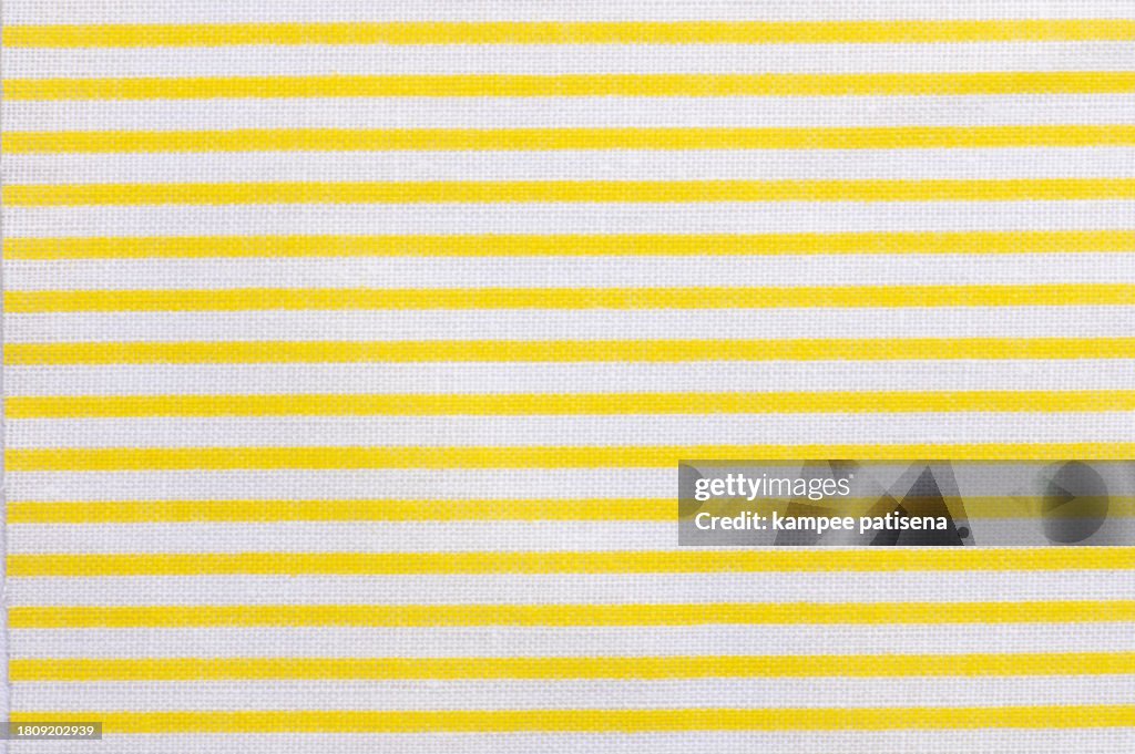 Textile background with a cotton fabric with a floral pattern, top view. Natural textile background. Fabric texture background. Texture of natural cotton fabric.