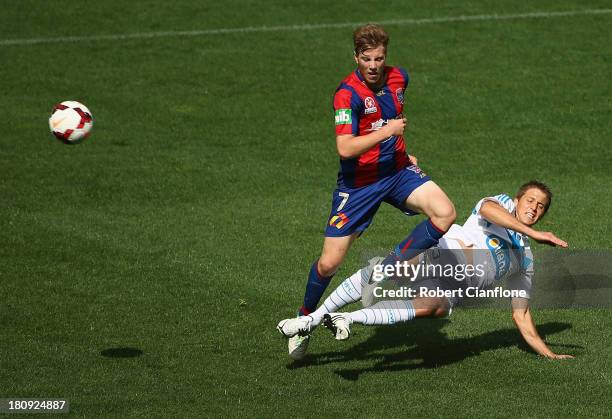 Adrian Leijer of the Victory challenges Andrew Hoole of the Jets during the A-League friendly match between the Melbourne Victory and the Newcastle...