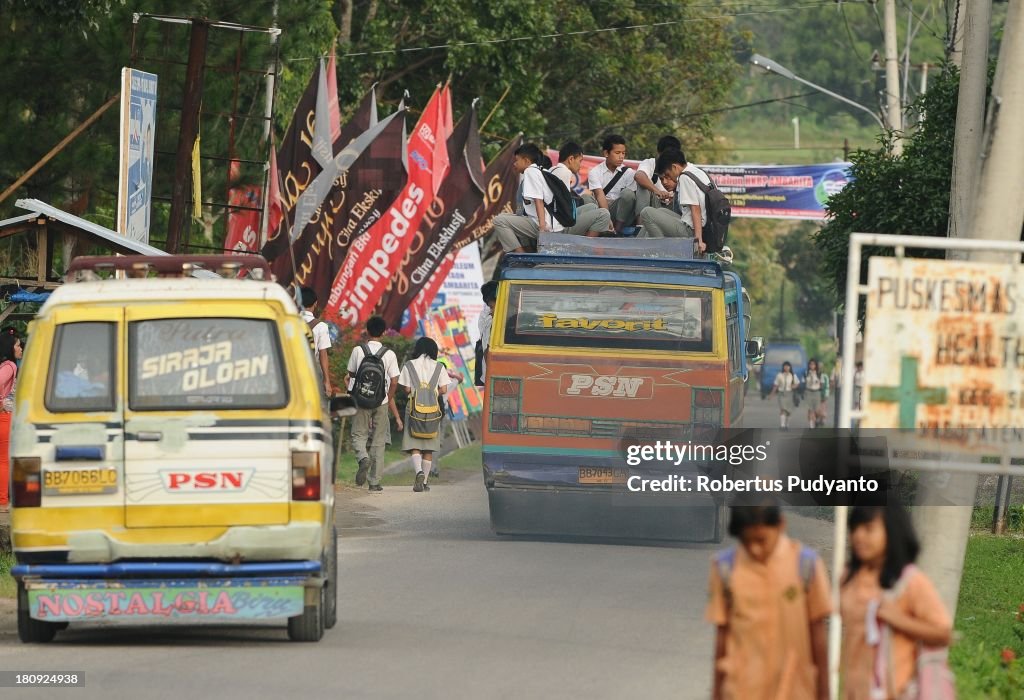Indonesian Students Ride Atop Buses On The School Run