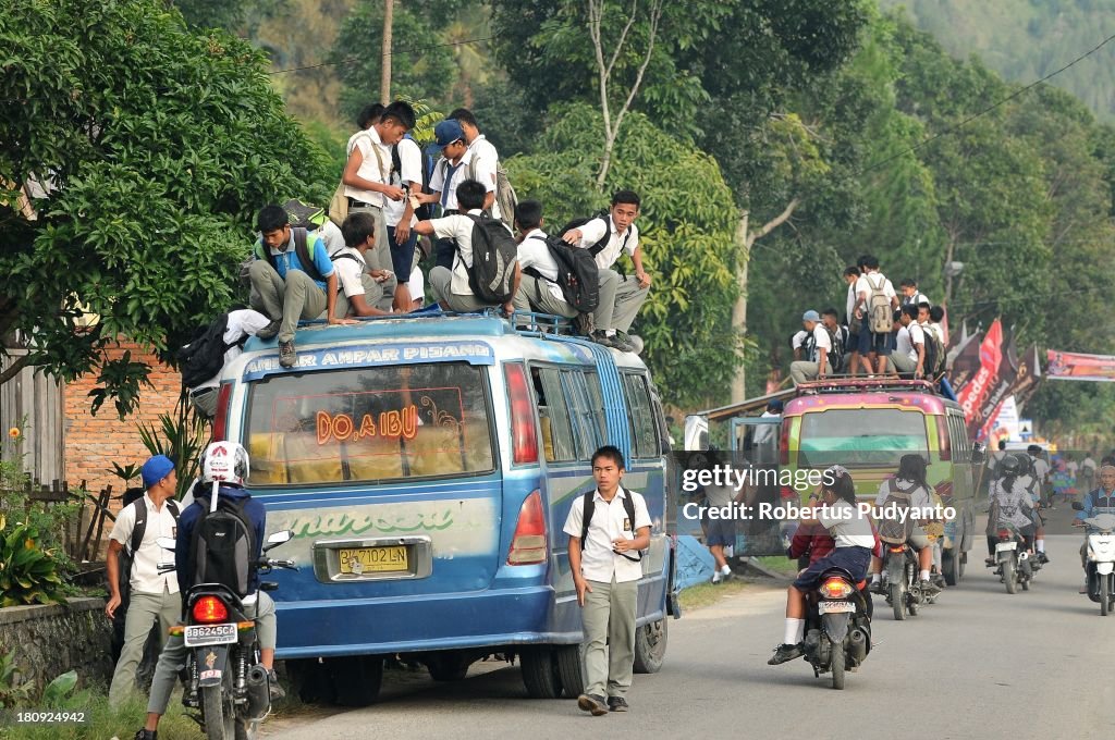 Indonesian Students Ride Atop Buses On The School Run