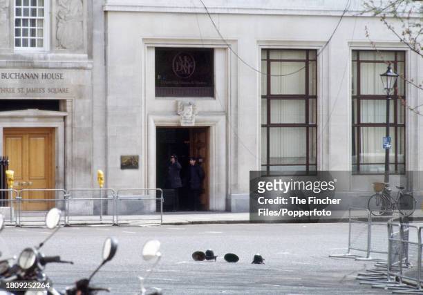 Police helmets on the road outside the Libyan Embassy under siege on St James's Square, London, 17th April 1984.