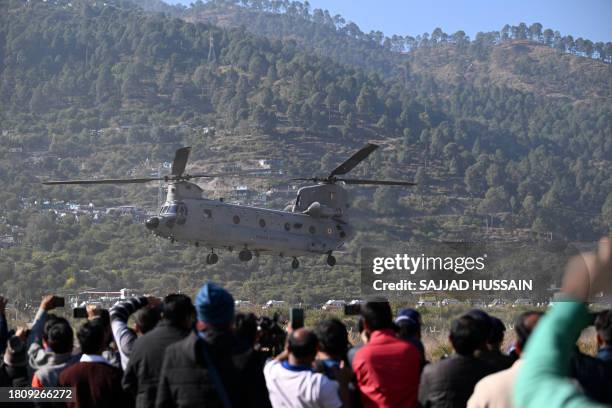 An IAF Chinook helicopter carrying rescued workers to a hospital in Rishikesh takes off at Chinyalisaur airstrip in Uttarakashi district of...