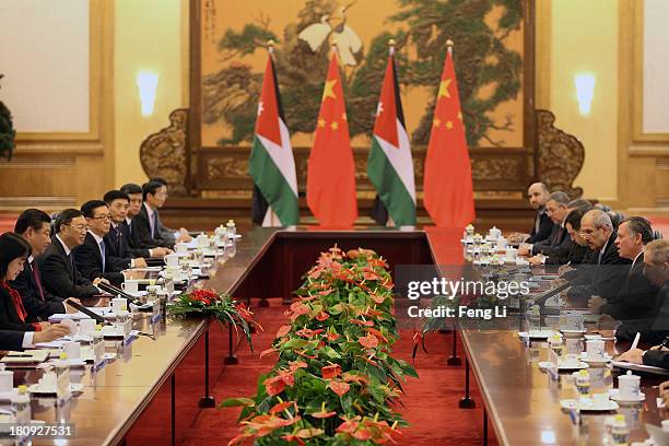 Chinese President Xi Jinping meets King Abdullah II bin Al Hussein of Jordan after a welcoming ceremony at the Great Hall of the People on September...