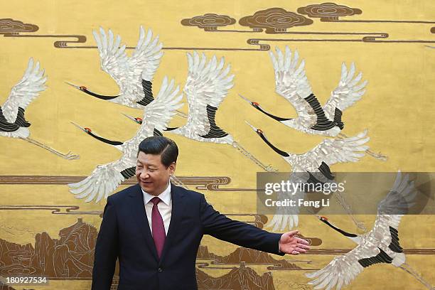 Chinese President Xi Jinping lets King Abdullah II bin Al Hussein of Jordan leave first after a signing ceremony at the Great Hall of the People on...