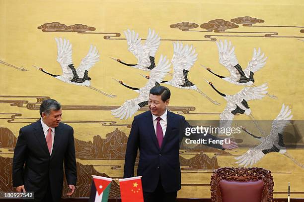 Chinese President Xi Jinping lets King Abdullah II bin Al Hussein of Jordan leave first after a signing ceremony at the Great Hall of the People on...