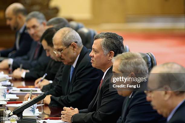 Chinese President Xi Jinping meets King Abdullah II bin Al Hussein of Jordan after a welcoming ceremony at the Great Hall of the People on September...