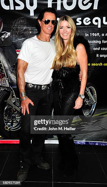 Actors Phil Pitzer and Jodie Fisher attend the premiere of "Easy Rider The Ride Back" Ride-In at Bartels' Harley-Davidson on September 17, 2013 in...