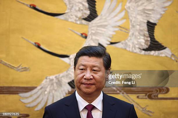 Chinese President Xi Jinping attends a signing ceremony with King Abdullah II bin Al Hussein of Jordan at the Great Hall of People on September 18,...