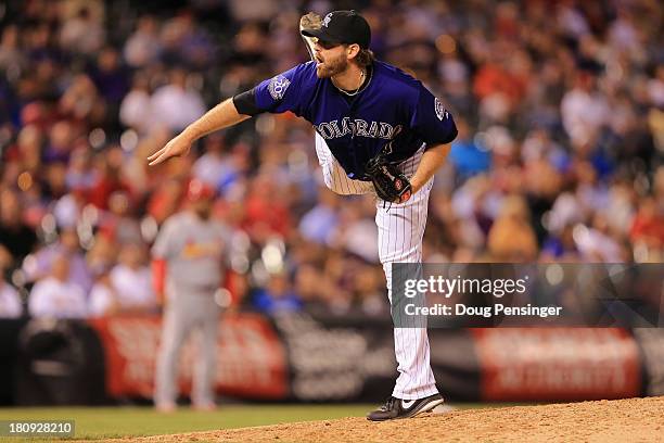 Relief ptcher Mitchell Boggs of the Colorado Rockies delivers against the St. Louis Cardinals at Coors Field on September 17, 2013 in Denver,...