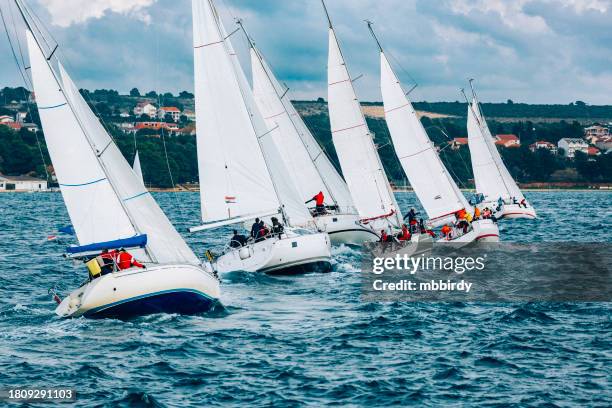 sailing crews on sailboats on regatta - sailing competition stock pictures, royalty-free photos & images