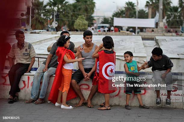 Barbed wire and debris still surround areas of Tunis, the capital of Tunisia a year and a half after former president Ben Ali was ousted by a popular...