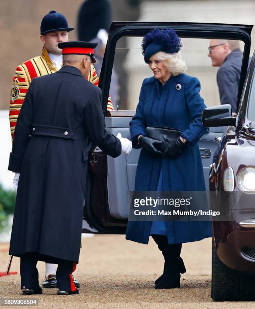 Queen Camilla is greeted by Sir Kenneth Olisa, Lord-Lieutenant of Greater London as she arrives, in her chauffeur driven Bentley State Limousine, to...