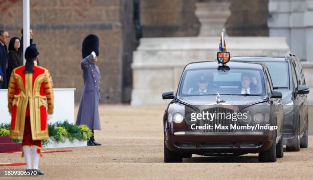 Liveried footman looks on as King Charles III and Queen Camilla arrive, in their chauffeur driven Bentley State Limousine, to attend a ceremonial...