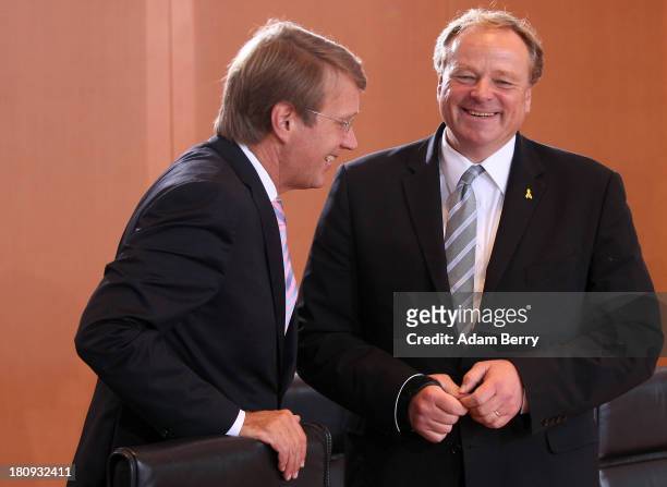 German Chancellery Chief of Staff Ronald Pofalla and German Economic Cooperation and Development Minister Minister Dirk Niebel arrive for the last...