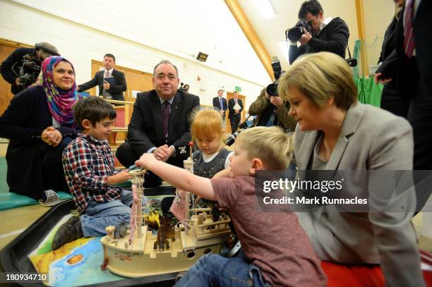 First Minister Alex Salmond and Deputy First Minister Nicola Sturgeon talk to children during a visits to the North Edinburgh Childcare Centre to...