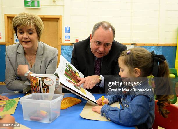 First Minister Alex Salmond and Deputy First Minister Nicola Sturgeon talk to children during a visits to the North Edinburgh Childcare Centre to...