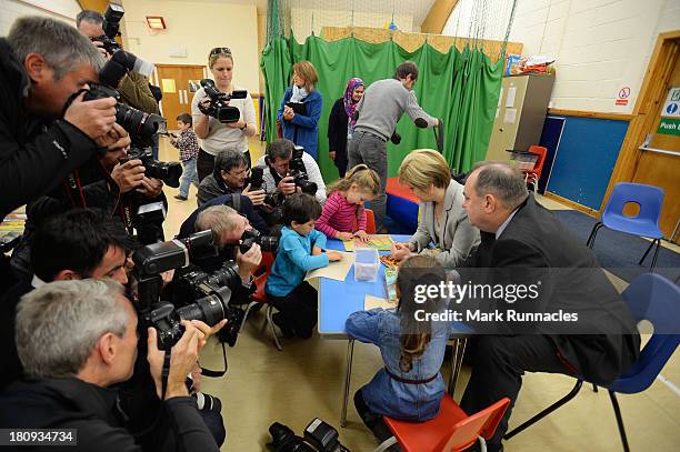 First Minister Alex Salmond and Deputy First Minister Nicola Sturgeon talk to children during a visits to the North Edinburgh Childcare Centre to...