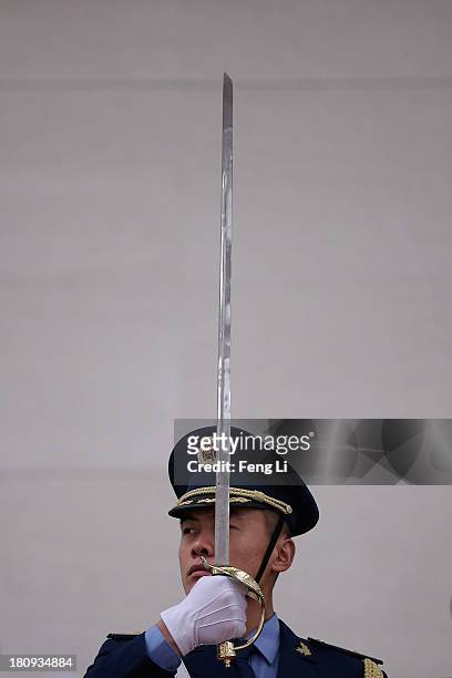 Soldier of a guard of honor rehearses before the welcoming ceremony for King Abdullah II Ibn Al Hussein of Jordan at the Great Hall of People on...