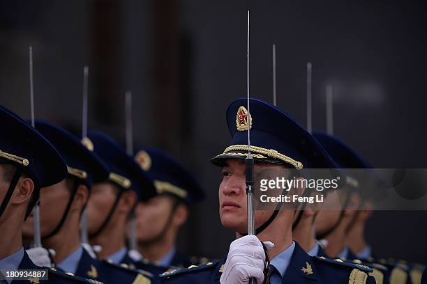Members of a guard of honor rehearse before the welcoming ceremony for King Abdullah II Ibn Al Hussein of Jordan at the Great Hall of People on...