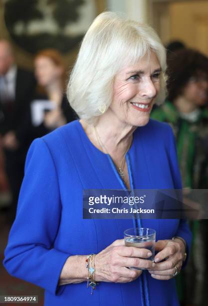 Queen Camilla smiles as she speaks to guests during the Booker Prize Foundation reception at Clarence House on November 23, 2023 in London, England.