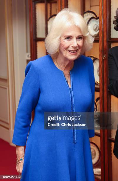 Queen Camilla smiles as she arrives to host the Booker Prize Foundation reception at Clarence House on November 23, 2023 in London, England.