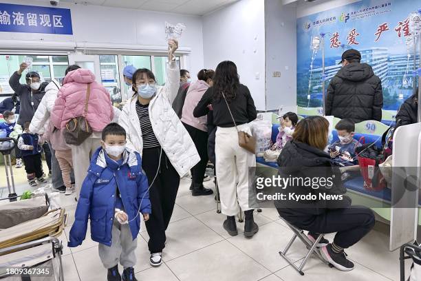 Children are hooked up to intravenous drips at a hospital in Beijing on Nov. 29 amid a pneumonia outbreak among children in the country.