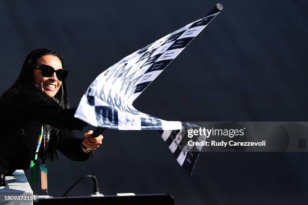 Marta waves the chequered flag during the F1 Grand Prix of Brazil at Autodromo Jose Carlos Pace on November 05, 2023 in Sao Paulo, Brazil.