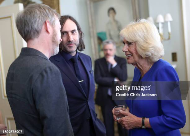 Queen Camilla smiles as she speaks with author Paul Murray , who is nominated for "The Bee Sting" and Paul Lynch , who is nominated for "Prophet...
