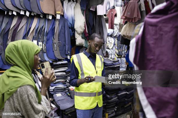 Kenya Revenue Authority tax agents visit a store in the Eastleigh district of Nairobi, Kenya, on Thursday, Oct. 19, 2023. Deploying 1,400 tax...